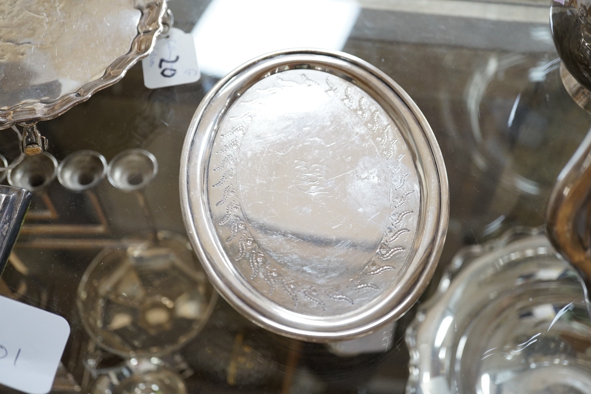A George III engraved silver oval teapot on stand, Hannah Northcote? London, 1804 and Georgian silver cream jug, marks rubbed, gross 24.8oz.
